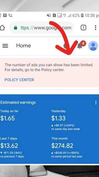 Mobile AdSense dashboard showing an ads-limited banner and earnings drop